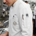 Sleeve pocket and chest pocket on a chef coat