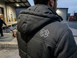 Back logo fully visible below a folded-down hood
