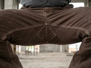 Diamond crotch gusset on work pants in a squat