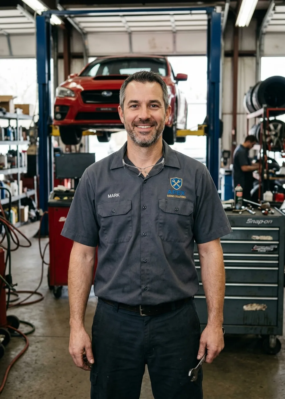 Technician wearing a short-sleeve twill work shirt with two chest pockets and an embroidered logo
