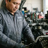 Snap-front placket on a mechanic's work shirt