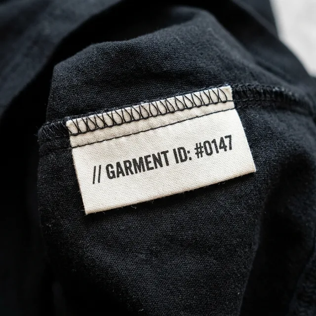 Inside ID label in a security shirt printed with a program code and the officer number