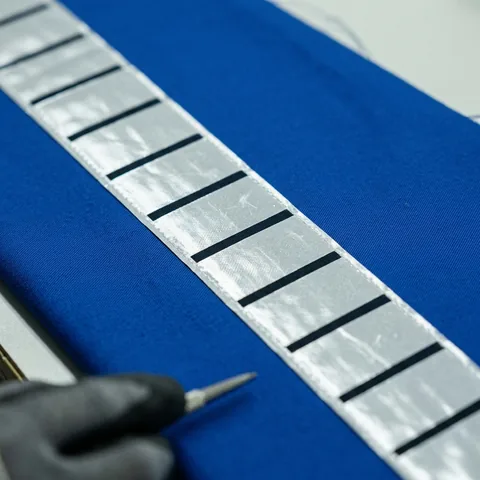 Close view of the reflective face of the tape, unbroken